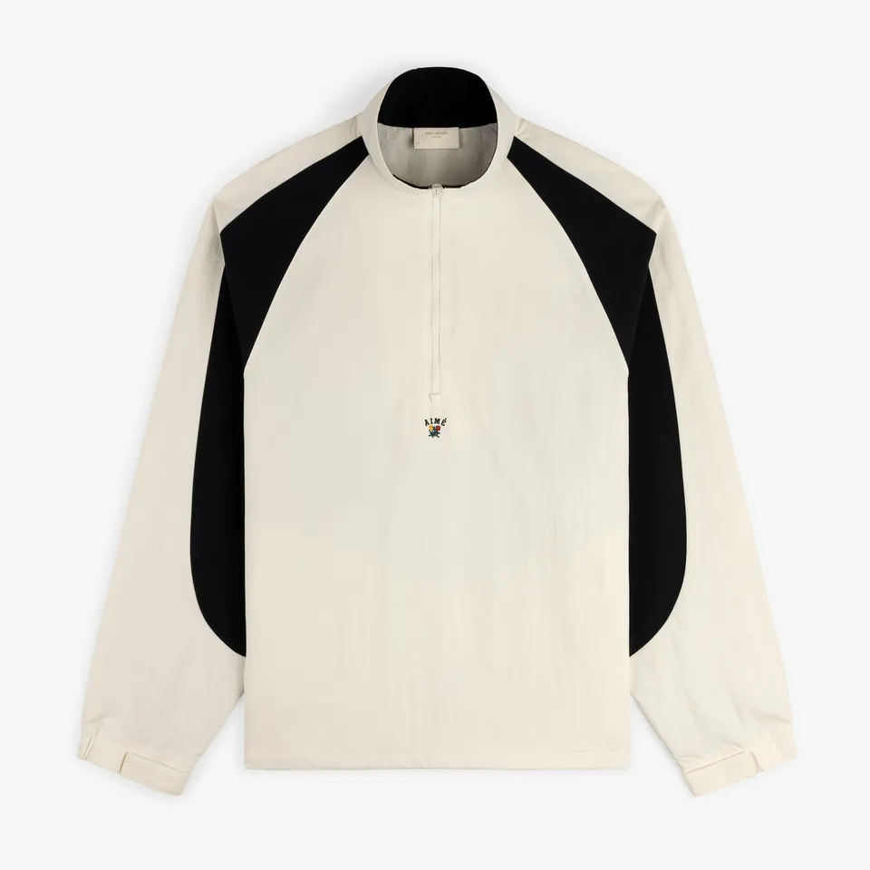 aim-leon-dore-crest-nylon-half-zip-pullover-creme image 1