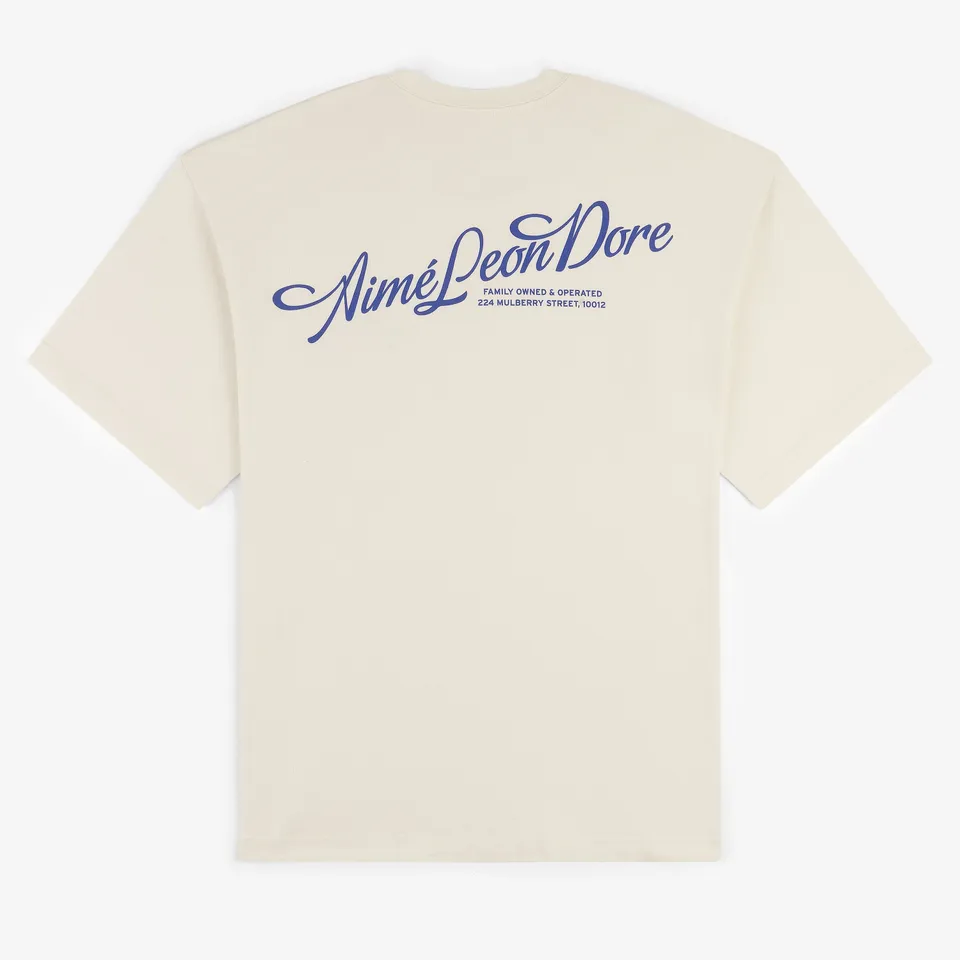aim-leon-dore-pappo-s-logo-t-shirt-cream-boxy-fit-245-gsm image 1