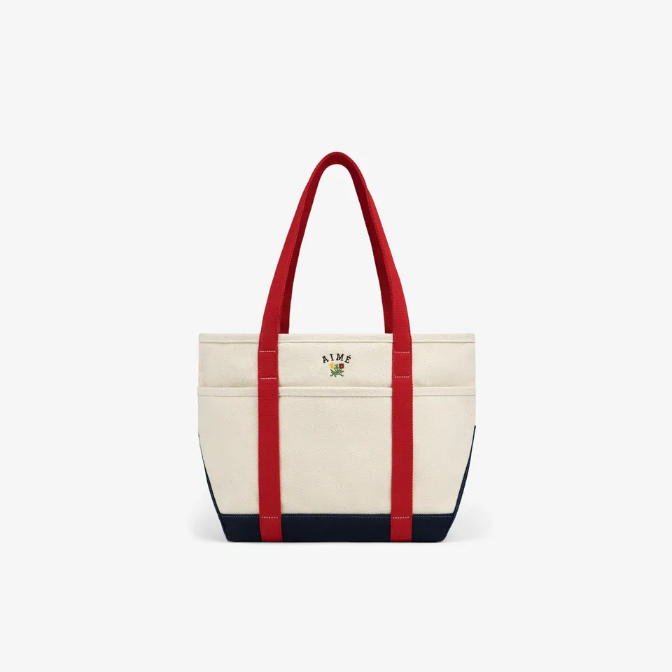 aim-leon-dore-small-crest-contrast-tote-bag-canvas-tote-in-cream-rot-navy image 1