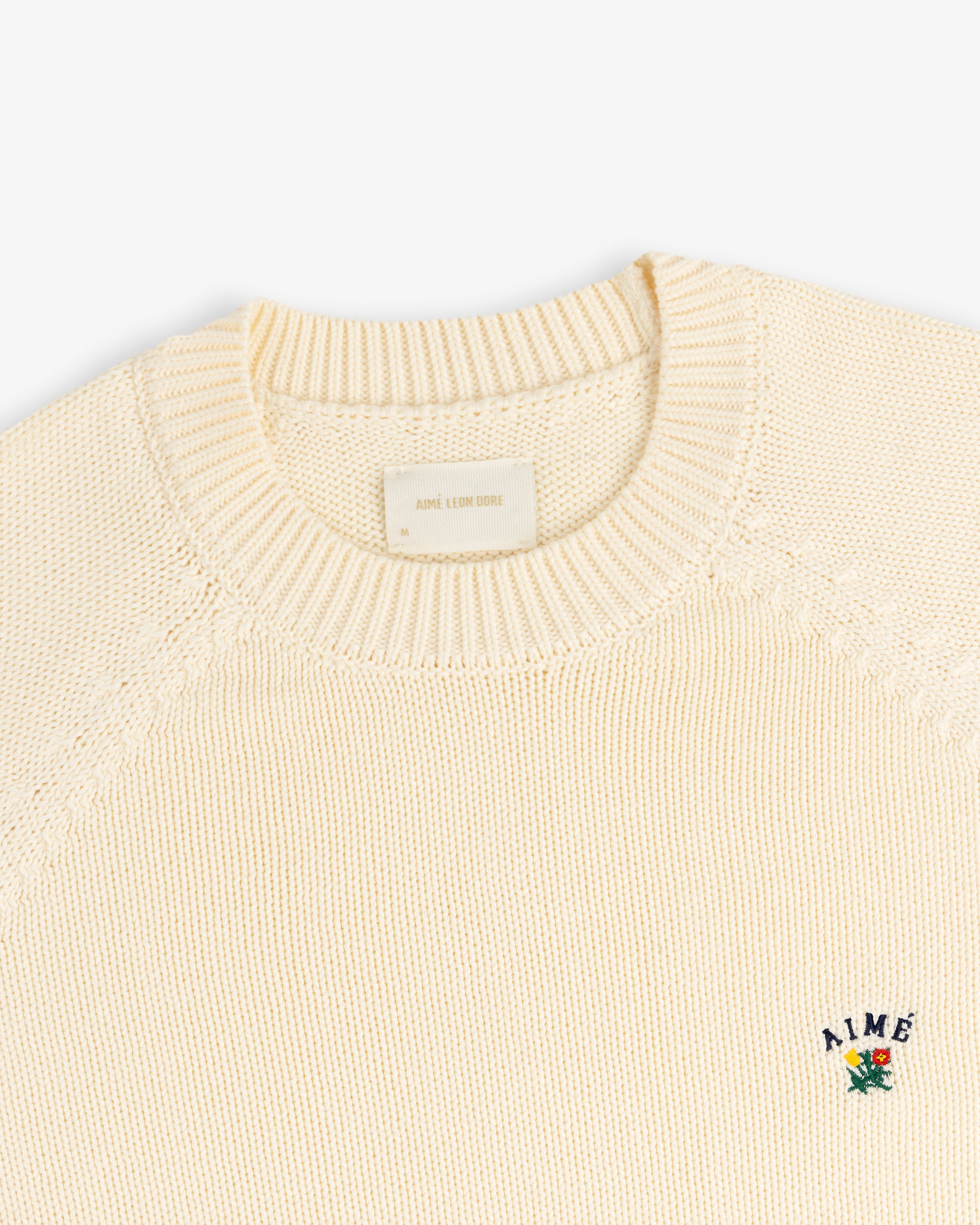 aim-leon-dore-crest-raglan-sweater-creme-strickpullover-baumwolle image 4